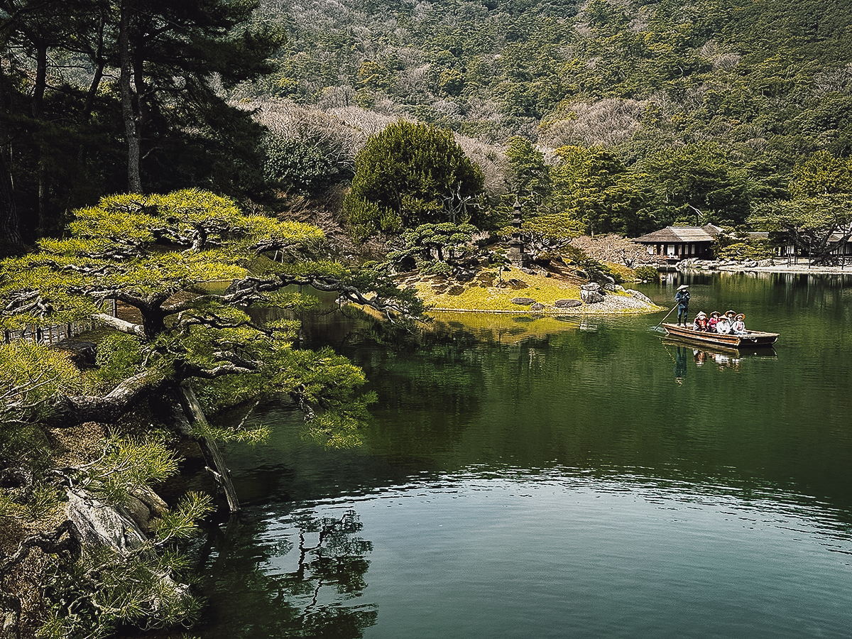 Boatman with passengers on a pond