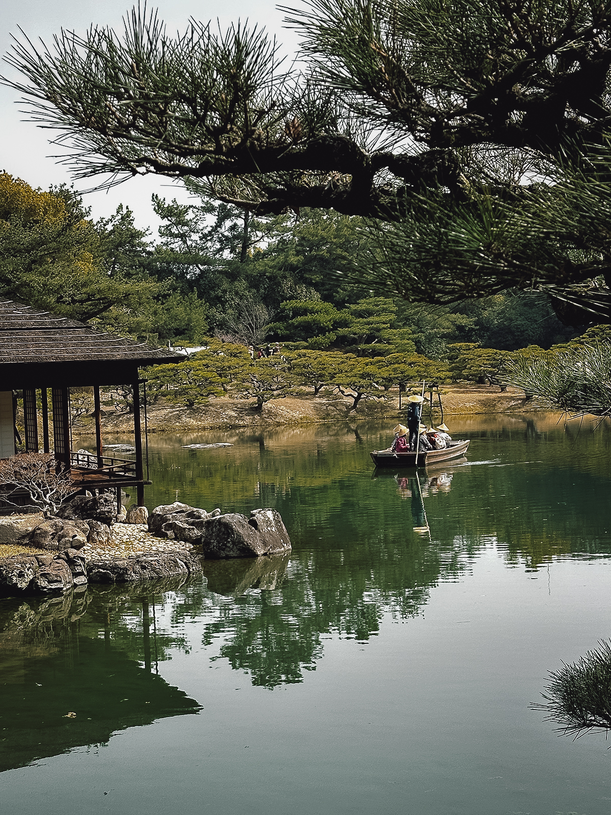 Boatman with passengers on a pond