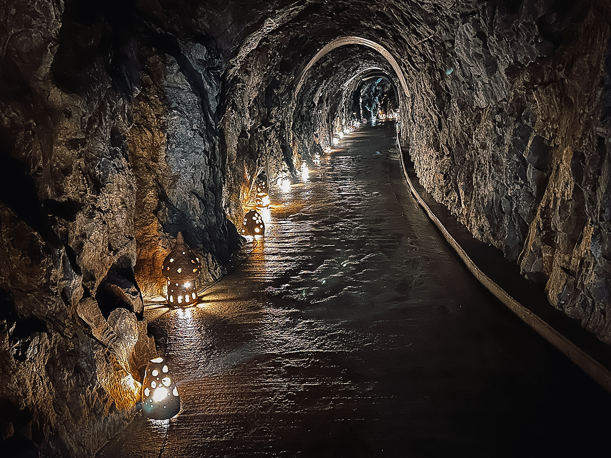 Illuminated tunnel inside Ryusendo Cave